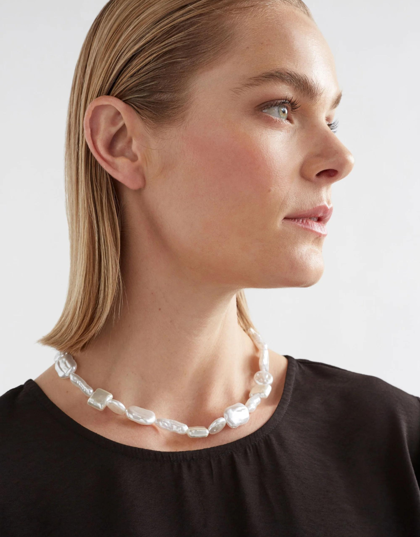 Elk Sota Necklace featuring a sleek, minimalist design with a silver finish, displayed on a neutral background.