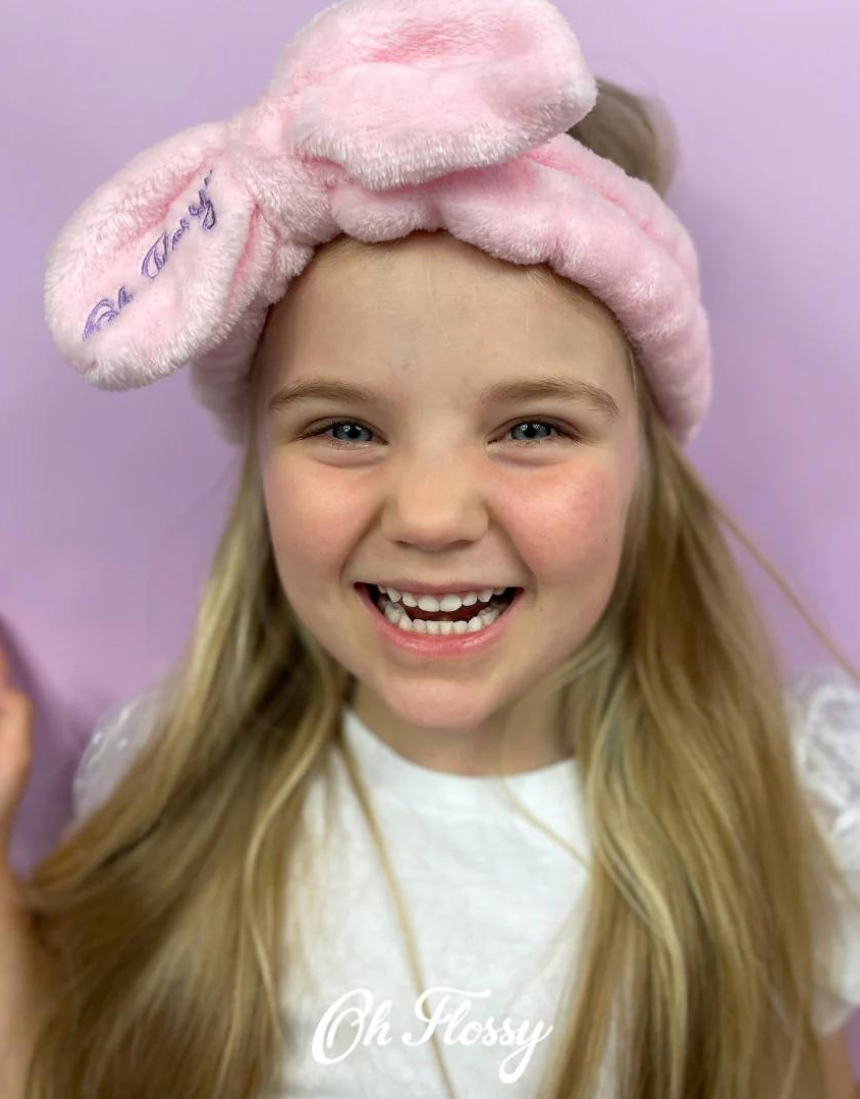Kids' Oh Flossy cosmetic headband with soft fabric and colorful design, ideal for young children’s hairstyling or accessories.