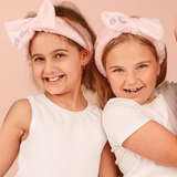 Kids cosmetic headband by Oh Flossy with colorful, soft fabric and playful design for children’s hair accessories.