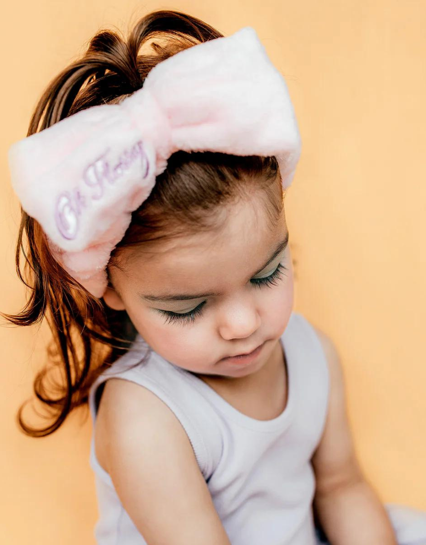 Kids cosmetic headband by Oh Flossy with colorful, soft fabric design perfect for playful and stylish hair accessories.