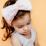 Kids cosmetic headband by Oh Flossy with colorful, soft fabric design perfect for playful and stylish hair accessories.