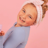 Kids' Oh Flossy cosmetic headband with pink and white floral pattern, soft fabric for comfortable wear.