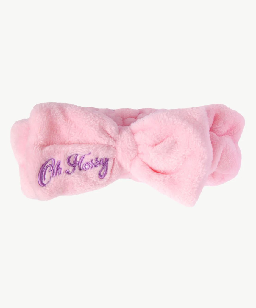 Kids wearing Oh Flossy cosmetic headbands with colorful, playful designs, perfect for styling and keeping hair in place.