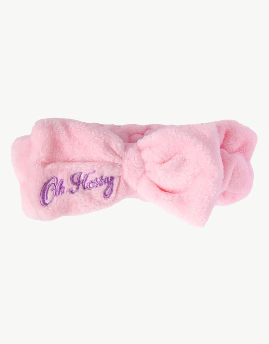Kids wearing Oh Flossy cosmetic headbands with colorful, playful designs, perfect for styling and keeping hair in place.