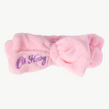 Kids wearing Oh Flossy cosmetic headbands with colorful, playful designs, perfect for styling and keeping hair in place.