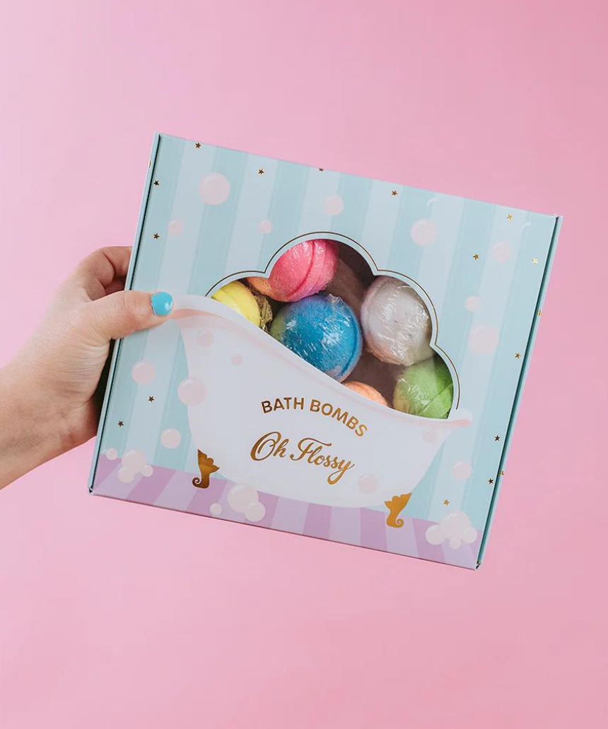 Colorful Oh Flossy Kids Mini Bath Bombs in various shapes and bright hues, perfect for fun bath time for children.