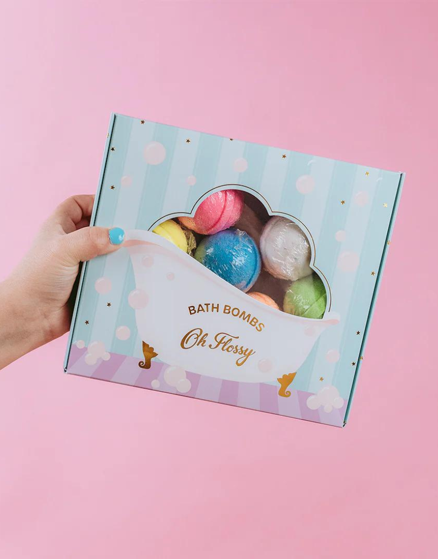 Colorful Oh Flossy Kids Mini Bath Bombs in various shapes and bright hues, perfect for fun bath time for children.