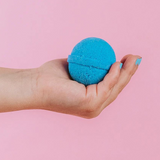Colorful Oh Flossy Kids Mini Bath Bombs set with small round bath bombs in vibrant packaging, designed for children.