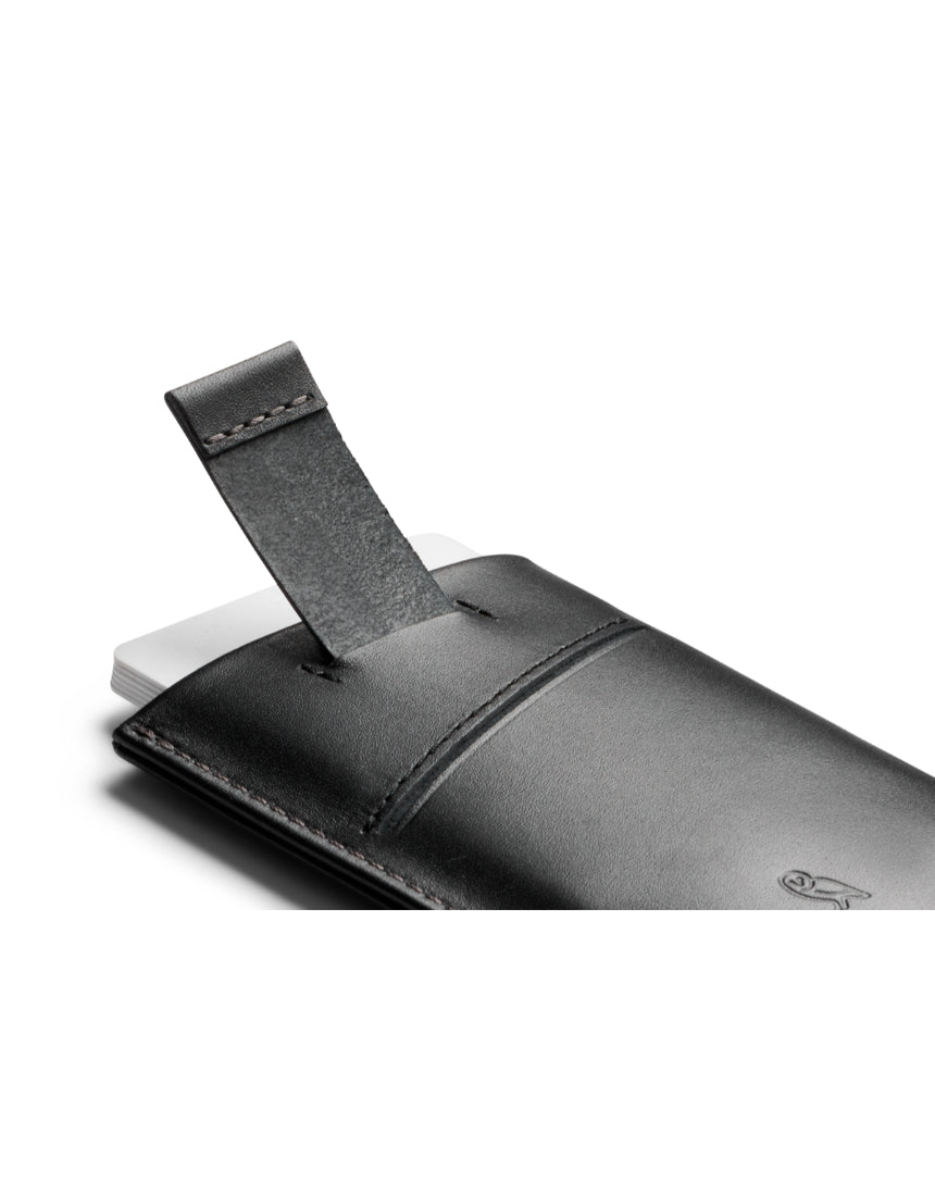 Bellroy Card Sleeve 2nd Edition in black, slim leather wallet with easy-access card slots, shown with multiple cards inserted.