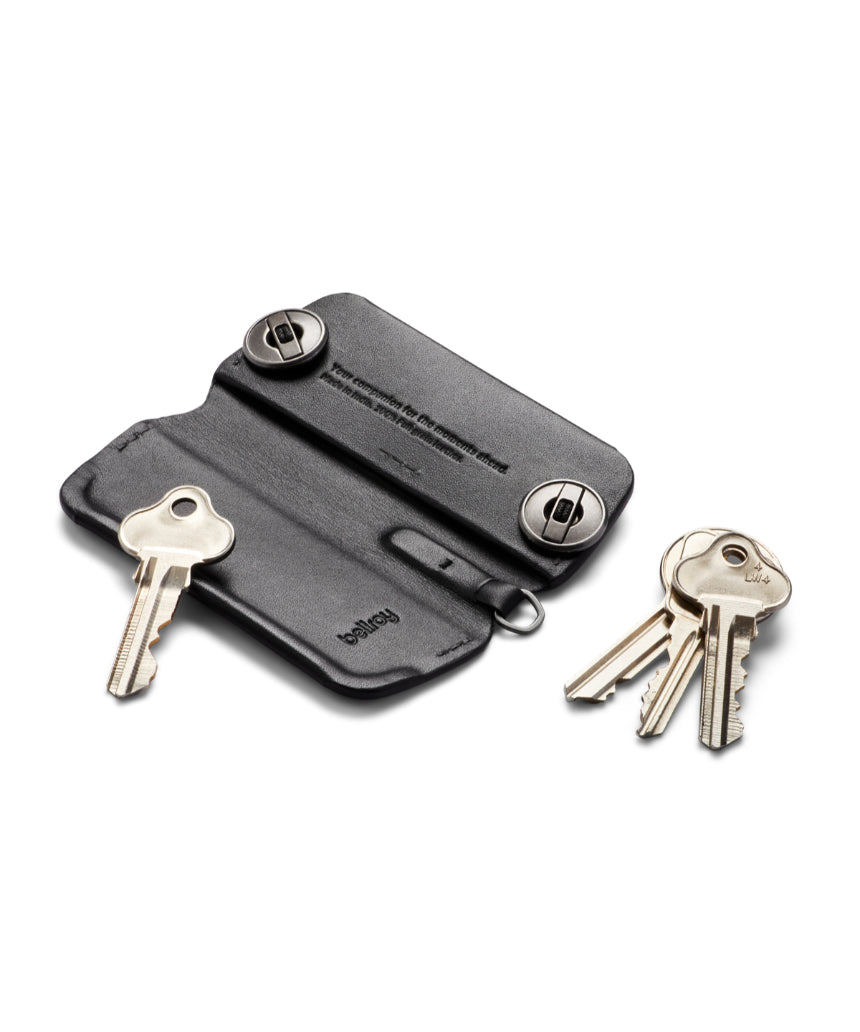 Black Bellroy Key Cover Plus 3rd Edition holding multiple keys on a keychain, made of sleek leather with subtle branding.