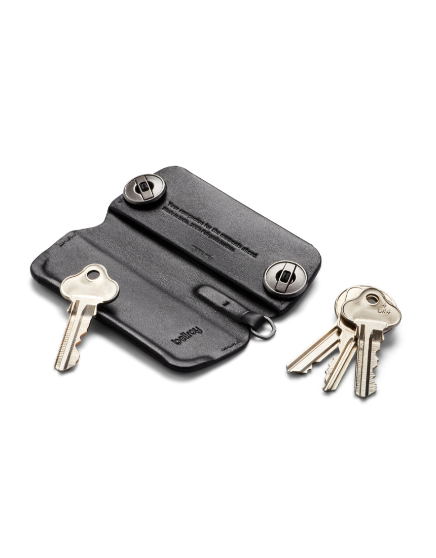 Black Bellroy Key Cover Plus 3rd Edition holding multiple keys on a keychain, made of sleek leather with subtle branding.