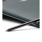 Bellroy Travel Wallet in Everglade leather showing multiple card slots and a folded design on a neutral background.