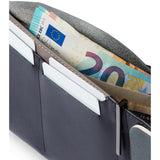Bellroy Travel Wallet in Everglade leather showing multiple card slots and a cash compartment on a neutral background.