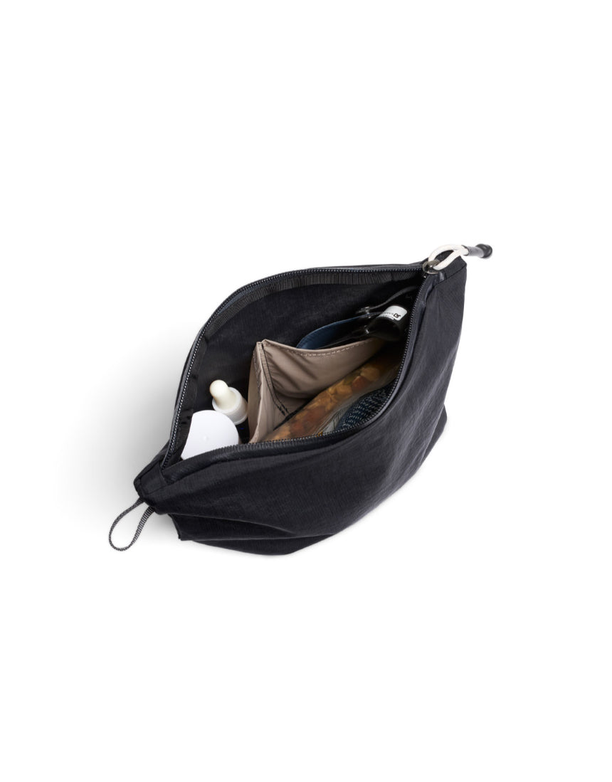Bellroy Light Pouch Duo in black, compact leather accessory with dual compartments for organization.