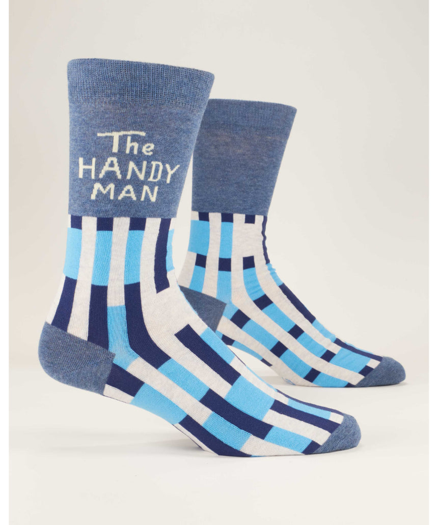 Blue Q The Handyman M-Crew socks featuring a colorful handyman design, made of soft fabric, shown laid flat.