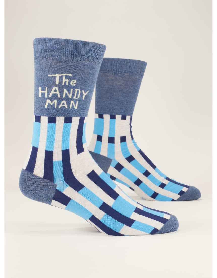 Blue Q The Handyman M-Crew socks featuring a colorful handyman design, made of soft fabric, shown laid flat.
