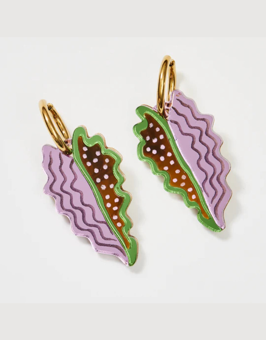 Tan and lilac Martha Jean Big Leaf earrings featuring large leaf-shaped design on silver hooks.