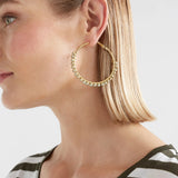Elk Oko Hoop Earring in ecru with a textured, circular design, showcasing a stylish and modern jewelry accessory.