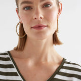 Elk Oko Hoop Earring in ecru, showcasing a sleek, minimalist design with a smooth round hoop and polished finish.