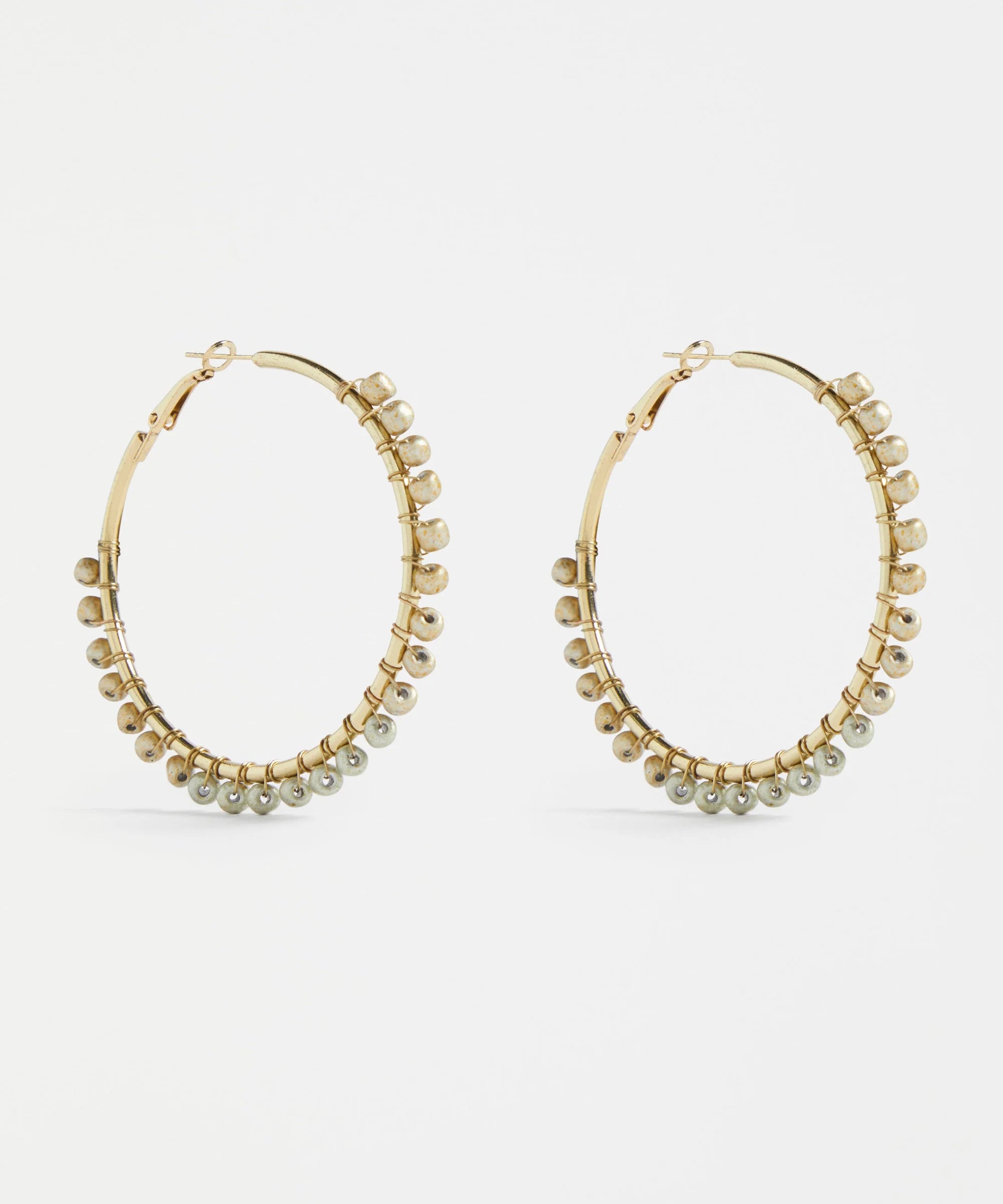 Elk Oko Hoop Earring in ecru color, showcasing a stylish, lightweight hoop design perfect for everyday wear