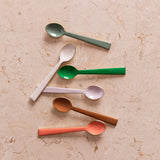 Bonnie and Neil enamel teaspoon in peach color, part of the cutlery set, with a smooth handle and shiny enamel finish.