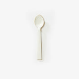 White enamel teaspoon from Bonnie and Neil cutlery set with a smooth handle and glossy finish.