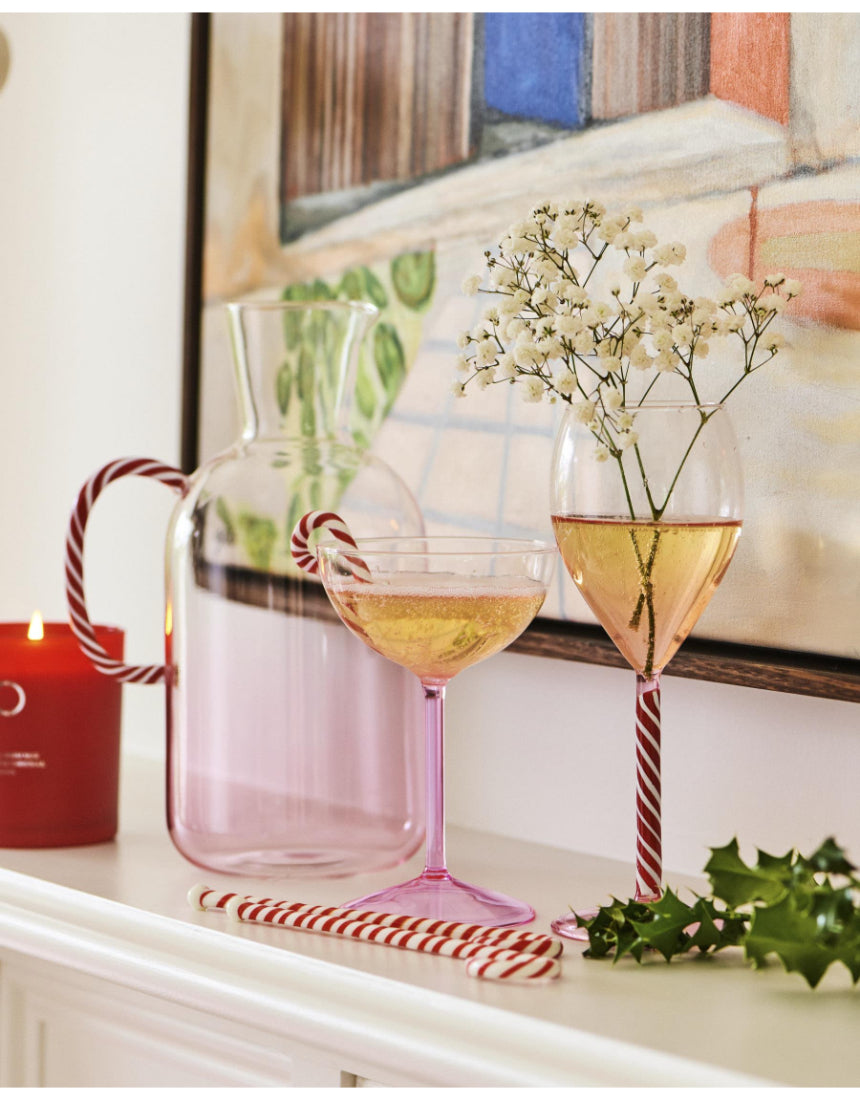 Kip & Co candy cane water jug with red and white striped design, made of glass or ceramic, featuring a classic festive pattern.