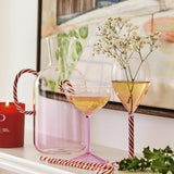 Kip & Co candy cane water jug with red and white striped design, made of glass or ceramic, featuring a classic festive pattern.