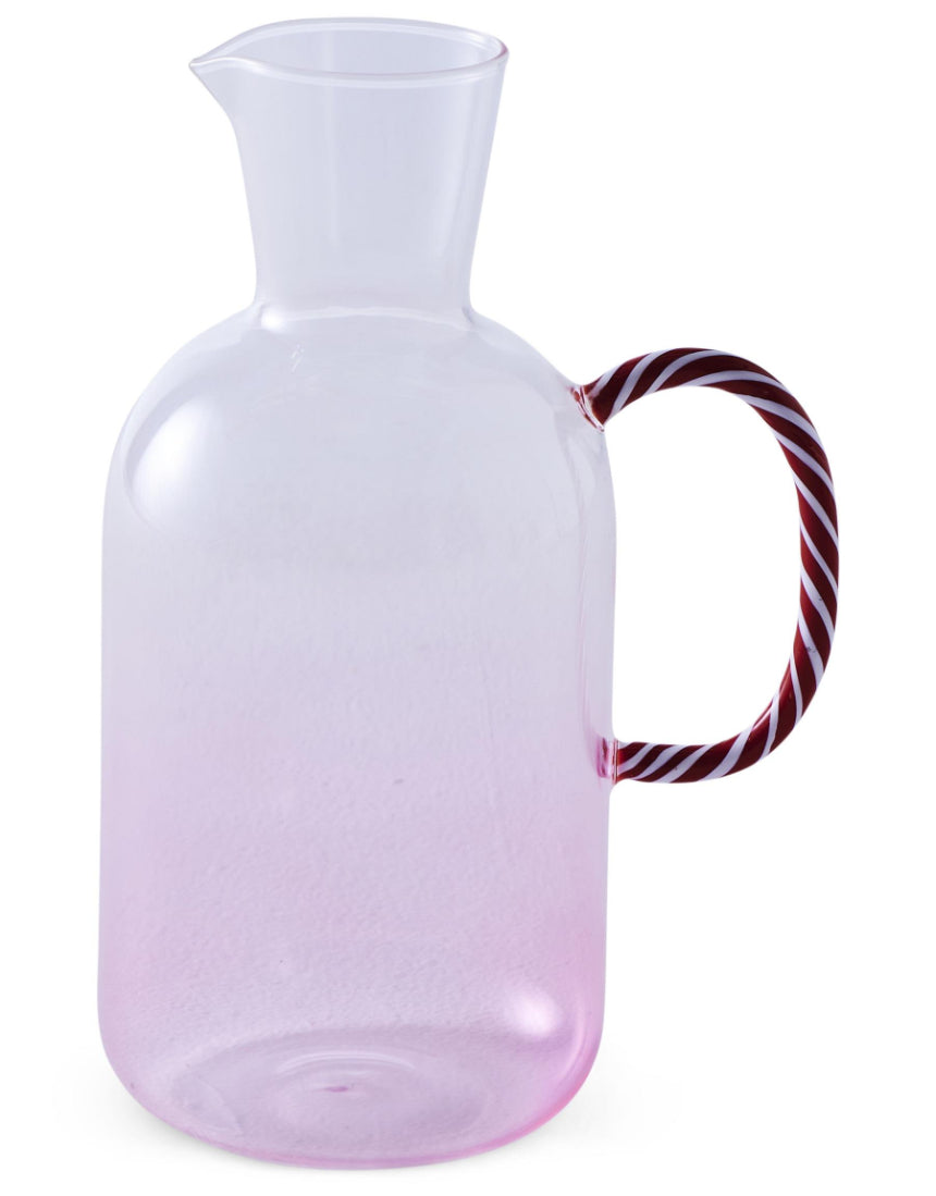 Kip & Co candy cane water jug with red and white striped design, large ceramic pitcher for beverages on a kitchen counter.