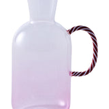 Kip & Co candy cane water jug with red and white striped design, large ceramic pitcher for beverages on a kitchen counter.