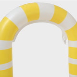 Sunnylife giant snake sprinkler watering garden with colorful, flexible snake-shaped sprinkler in outdoor yard scene.