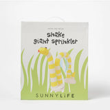Sunnylife Snake Giant Sprinkler in bright yellow and green, shaped like a snake, with water spraying from its mouth on a lawn.