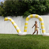 Sunnylife giant snake sprinkler spraying water, colorful outdoor garden sprinkler for kids and summer fun.