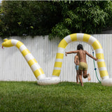 Sunnylife Snake Giant Sprinkler spread out on grass, colorful garden sprinkler in snake shape for outdoor fun and watering.