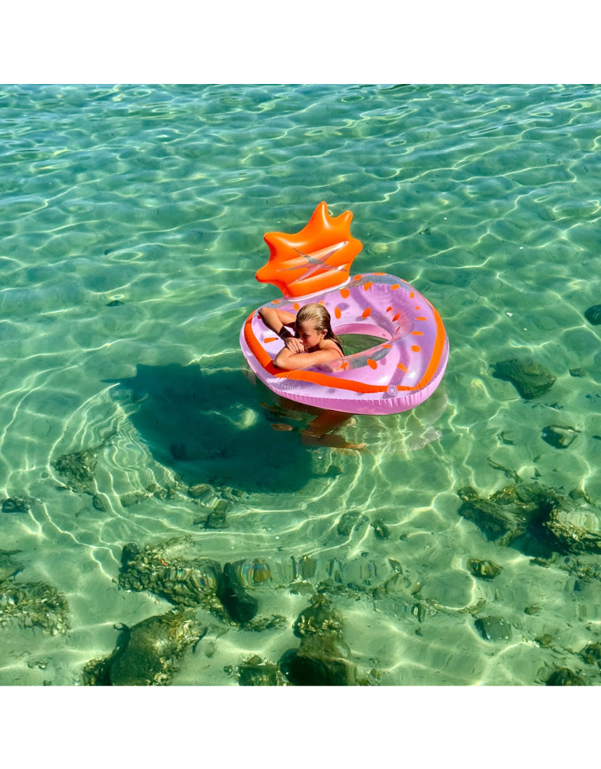 Sunnylife Luxe Pool Ring in strawberry pink, inflatable pool float with a round shape and vibrant color for lounging in the water.