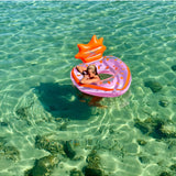 Sunnylife Luxe Pool Ring in strawberry pink, inflatable pool float with a round shape and vibrant color for lounging in the water.