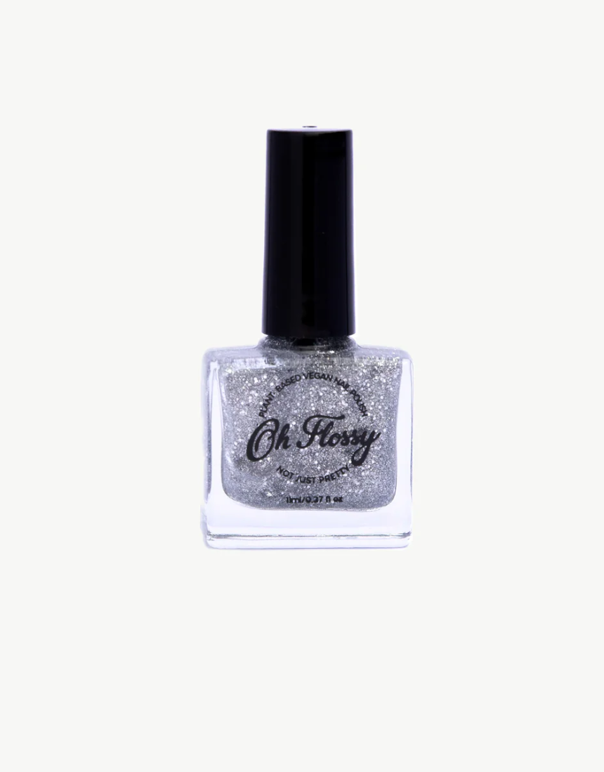 Kids' Oh Flossy nail polish bottle with colorful label and clear glass showcasing bright pink nail color.