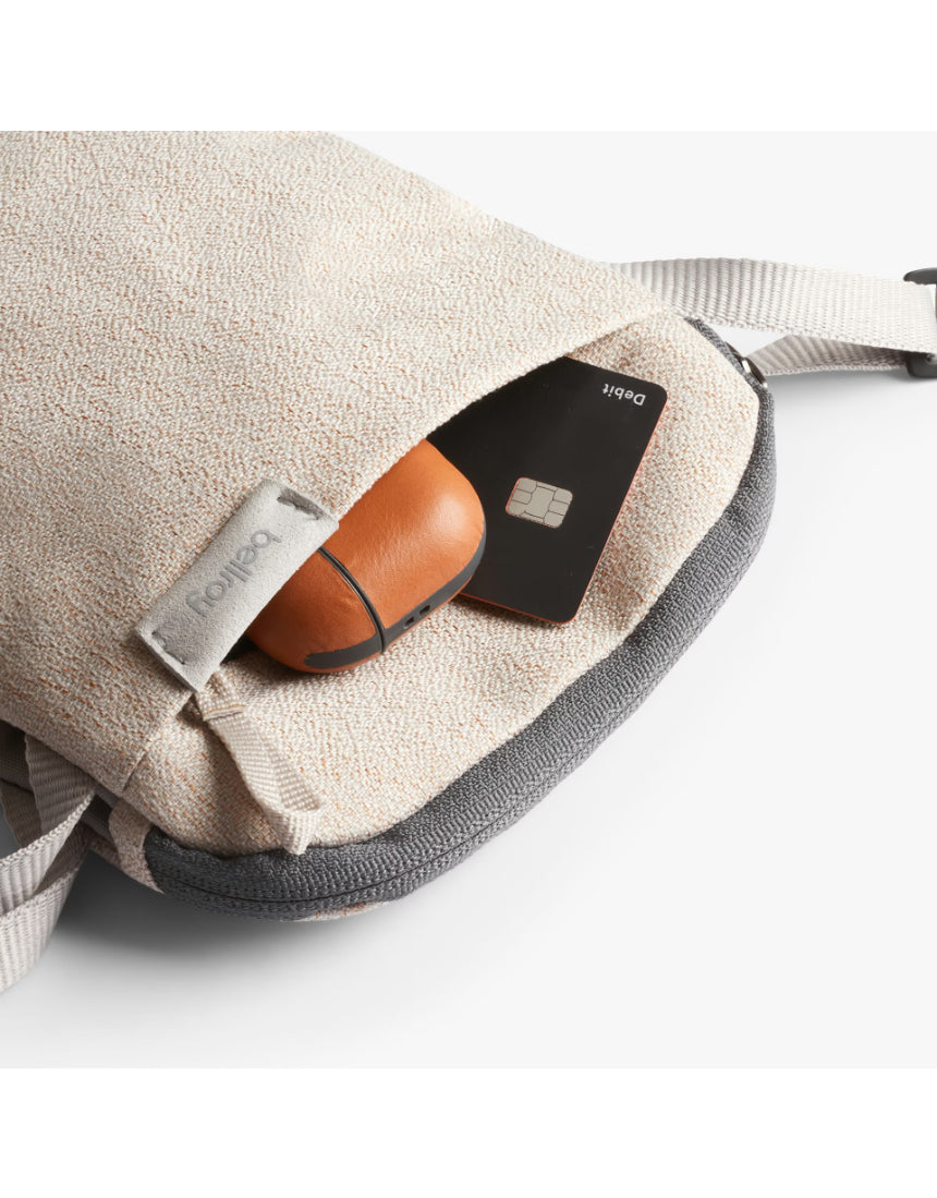 Bellroy City Pouch in Saltbush color, sleek compact bag with zip closure and multiple compartments for everyday organization.