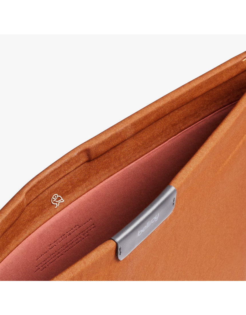 Bellroy 16-inch bronze laptop sleeve with sleek design and soft interior lining, suitable for protecting and carrying a laptop.