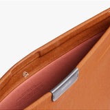 Bellroy 16-inch bronze laptop sleeve with sleek design and soft interior lining, suitable for protecting and carrying a laptop.