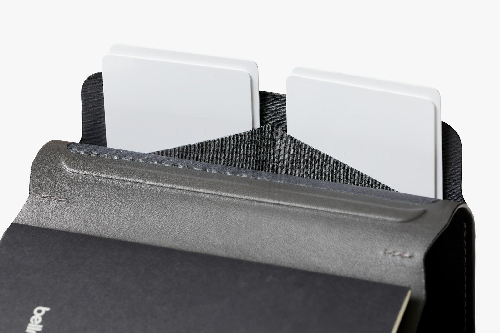 Bellroy black notebook cover showing smooth leather exterior and slim design for storing notebooks and small accessories.