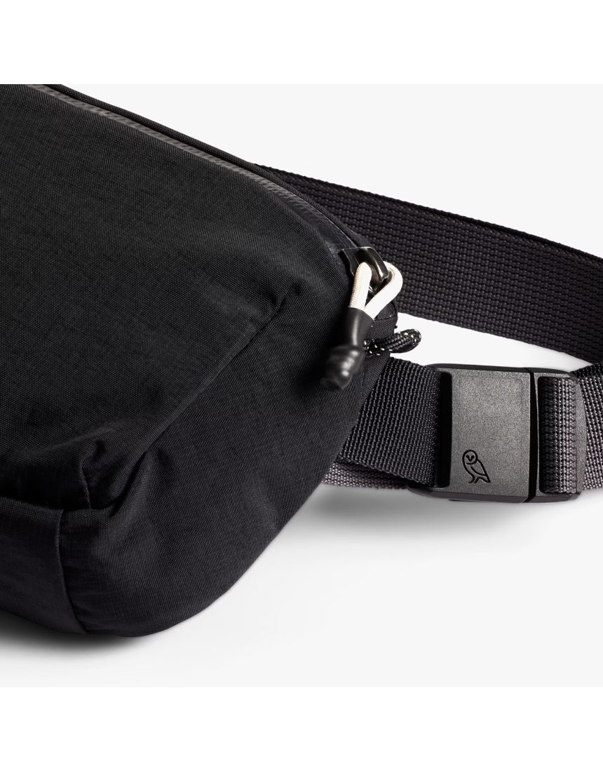 Bellroy Lite Belt Bag in black with adjustable strap and compact design, perfect for carrying essentials on the go.
