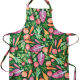 Kip & Co veggie soup apron with colorful vegetable print, adjustable neck strap, and front pocket, made for cooking and kitchen use.