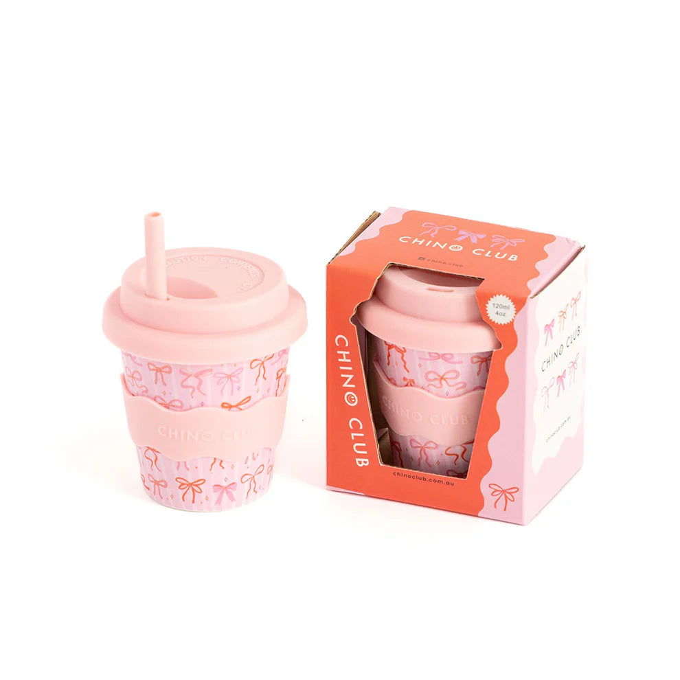 Chino Club Bows Baby Chino Cup 4oz, kids cup with colorful bows design, displayed inside its box.