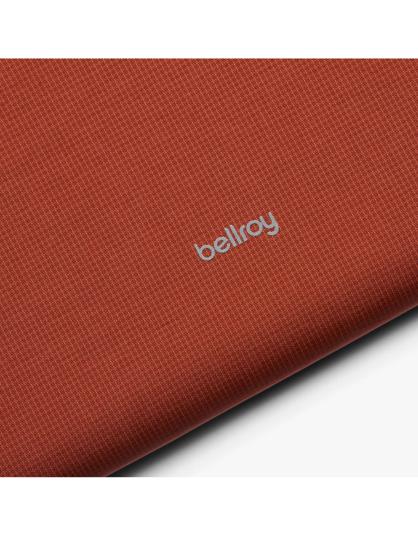 Bellroy Lite 14-inch Clay laptop sleeve showing a slim, protective case with a smooth, clay-colored exterior and minimalist design.