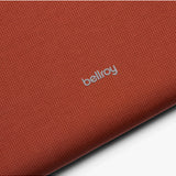 Bellroy Lite 14-inch Clay laptop sleeve showing a slim, protective case with a smooth, clay-colored exterior and minimalist design.
