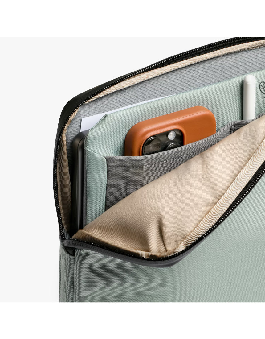 Bellroy 14-inch Laptop Caddy in Eucalyptus with multiple compartments for organizing accessories and cables.