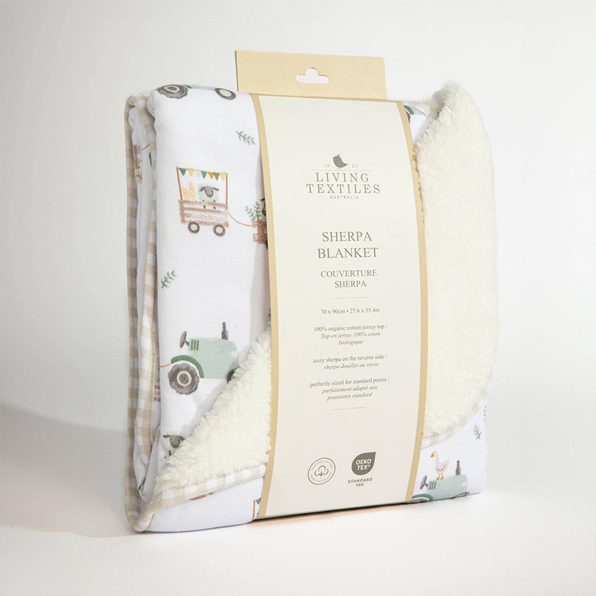 Living Textiles Jersey Sherpa Blanket featuring a tractor ride pattern, soft fabric with cozy fleece side and smooth jersey side.