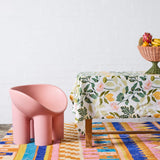 Kip & Co Wander rectangular tablecloth with colorful, patterned fabric draped over a dining table for a vibrant look.
