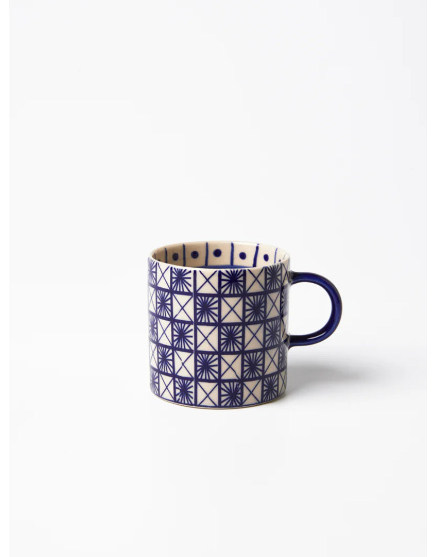 Jones & Co Caravan Espresso Indigo ceramic mug with detailed blue and white pattern, perfect for coffee or tea.